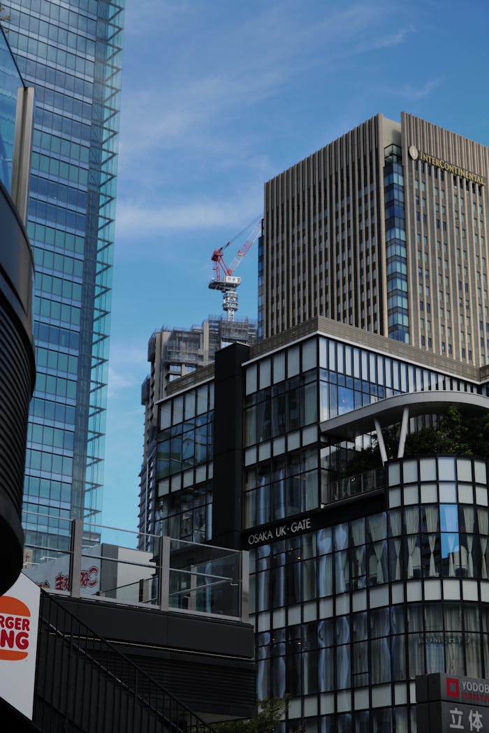 Contemporary buildings in Osaka's skyline with blue sky background.